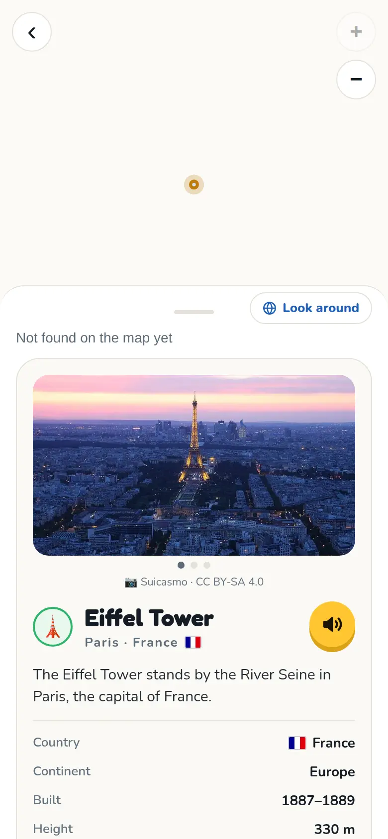 Una página de Conocimiento del Mundo sobre la Torre Eiffel, con foto y datos.